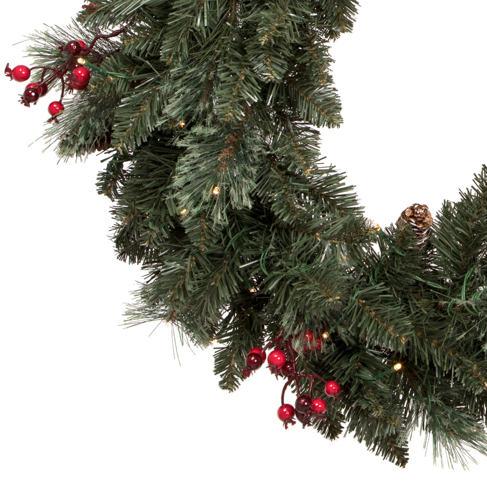 Vickerman Artificial 4 Piece Decorated Front Door Set with 200 Battery Operated Warm White 3MM LED lights. Includes two 3.5' Potted Trees one 30" Wreath and one 9' Garland. This incredible set features battery operated Warm White LED lights pine cone and