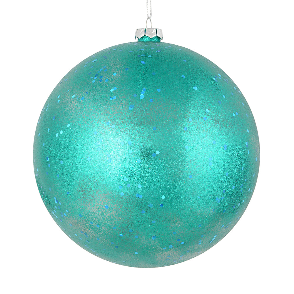 Vickerman 6" Teal Glitter Clear Ball. This ornament features a clear complexion with a dusting of teal glitter inside. Add a touch of glam to any holiday arrangement with this delicate looking ornament. Made with shatterproof plastic. Includes 4 pieces pe