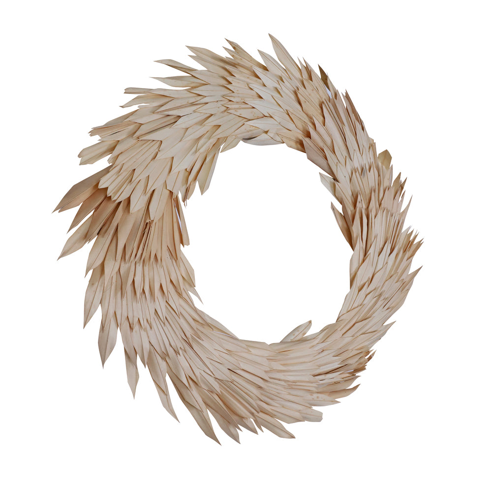 Vickerman Natural Botanicals 24" Bleached Palm Sun Wreath. This wreath measures 24 inches in diameter. It features bleached palm sun leaves on a coco fiber base. This is a dried and preserved natural product.