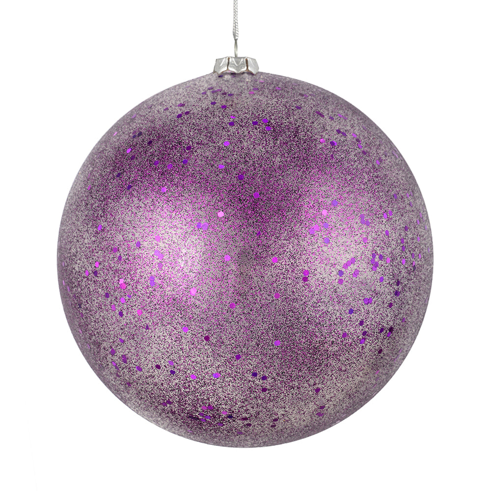 Vickerman 4.75" Plum Glitter Clear Ball. This ornament features a clear complexion with a dusting of plum glitter inside. Add a touch of glam to any holiday arrangement with this delicate looking ornament. Made with shatterproof plastic. Includes 4 pieces