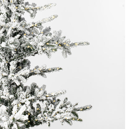 Vickerman 9' x 65" Flocked Yukon Display Artificial Christmas Tree with Warm White LED Lights.