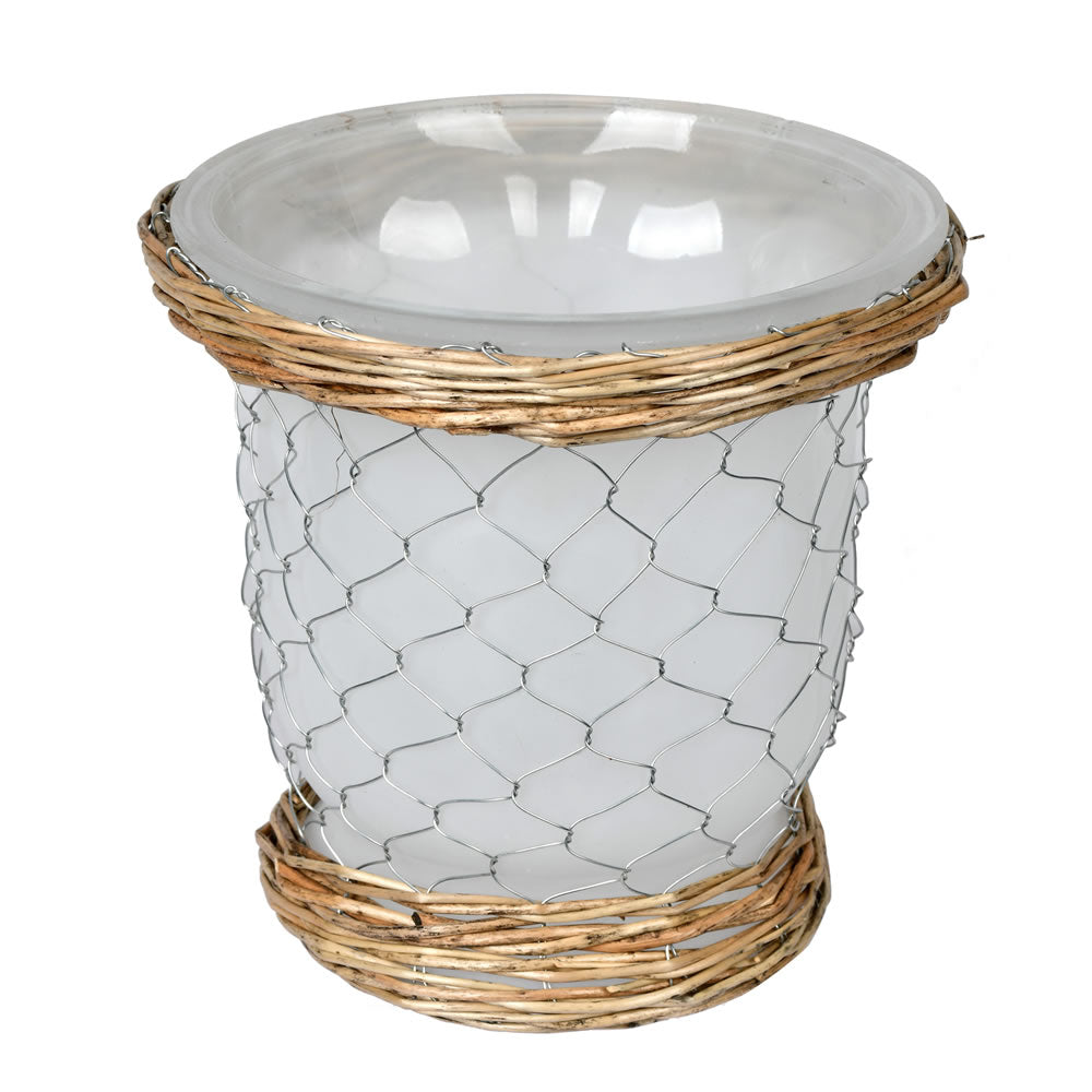 Vickerman 7.3" Frosted Glass Vase Chicken Wire Wicker. It features a frosted finish on the glass silver chicken wire and natural tone wicker accents on the top and bottom. It measures 7.3 inches tall and 7.5 inches wide.  70% GLASS 15% IRON WIRE 15% WILLO