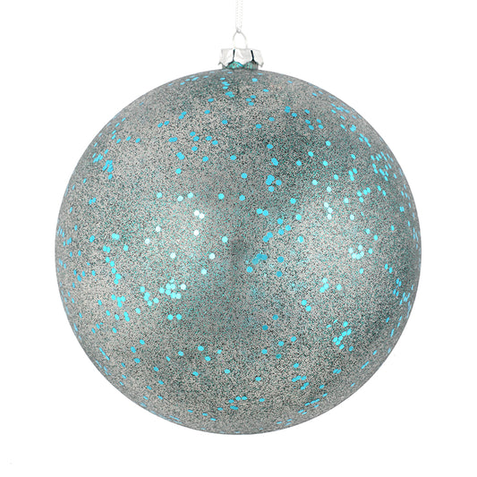 Vickerman 4.75" Sea Blue Glitter Clear Ball. This ornament features a clear complexion with a dusting of sea blue glitter inside. Add a touch of glam to any holiday arrangement with this delicate looking ornament. Made with shatterproof plastic. Includes