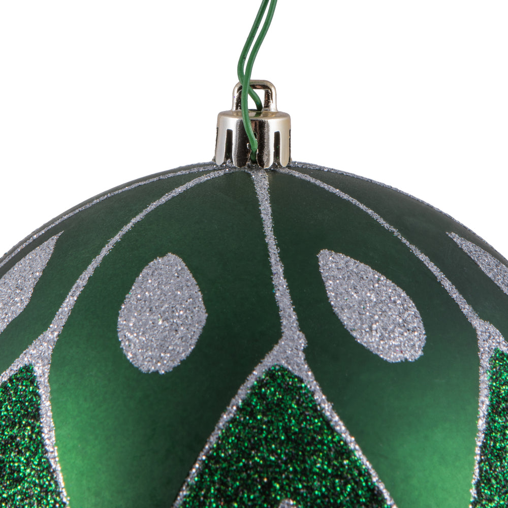 Vickerman 4.75" Emerald Matte Ball with Glitter Diamond Pattern. Add variety and sparkle to your holiday arrangement with this matte ornament that features a glitter pattern. Includes 4 pieces per bag. Made with shatterproof plastic. Ornament has a drille