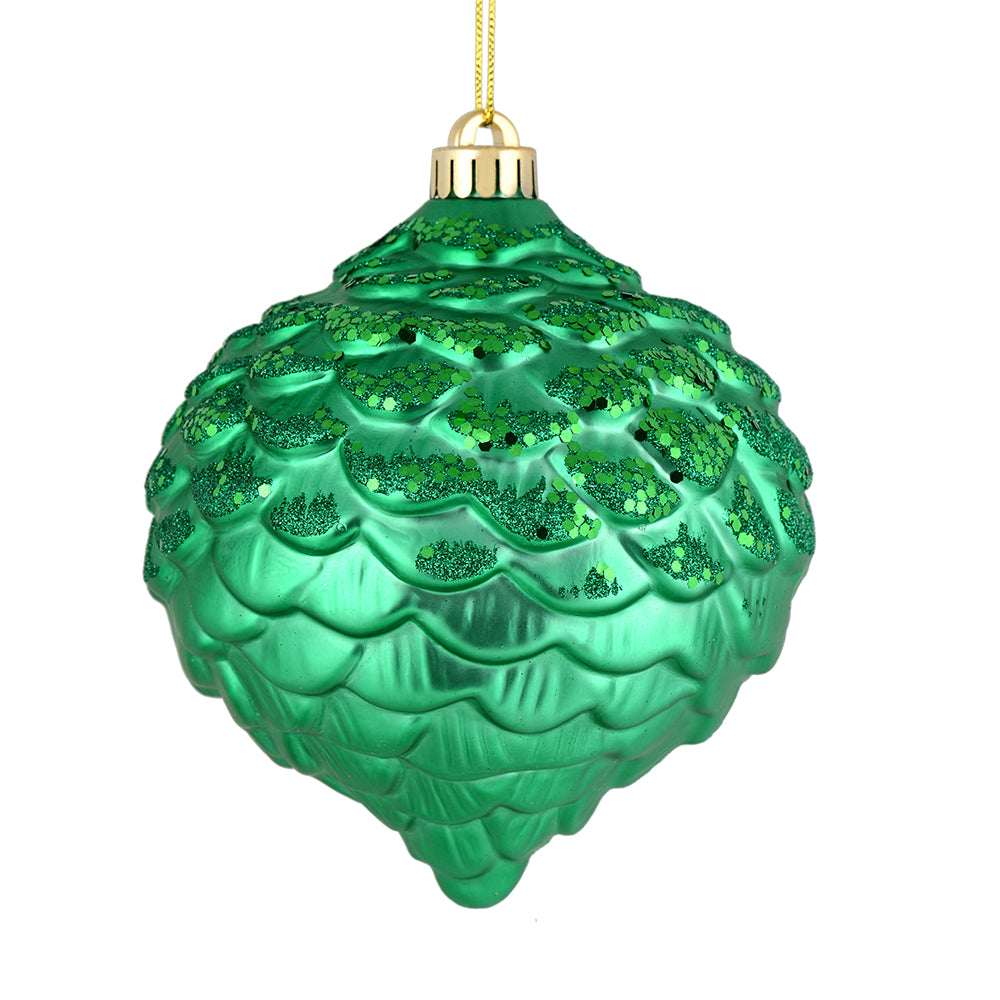 Vickerman 6" Seafoam Green Glitter Ornament. This ornament features a matte embossed top with glitter accents and a shiny bottom. The variety of finishes on this ornament creates elegance that will complement any holiday decorating project. Made with shat