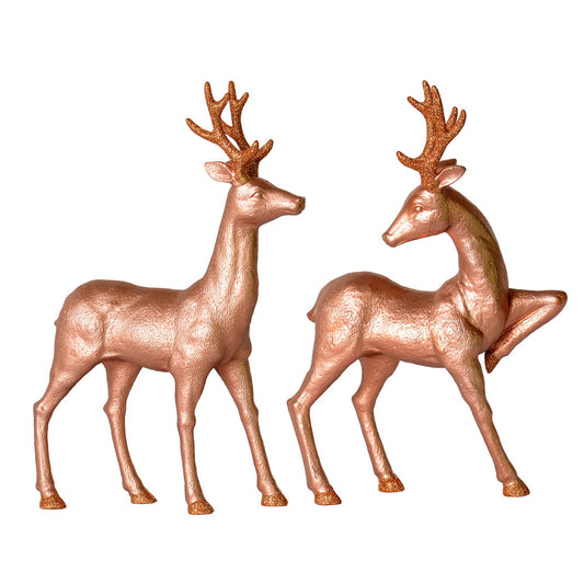 Vickerman 13" Rose Gold Deer Set with Glitter. This assortment of two includes one standing deer and one pointing deer. These feature glitter accents on the antlers and hooves.