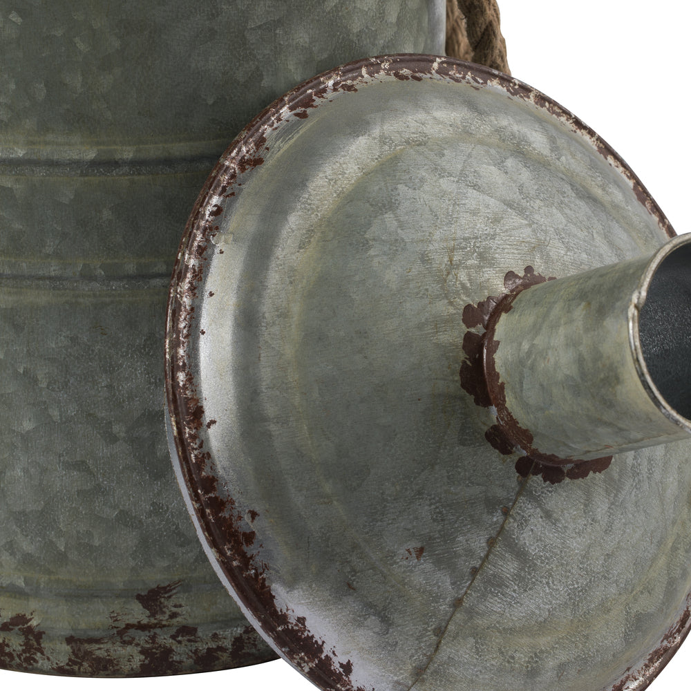 Vickerman 19.5" Rustic Metal Container with Handles. This metal container is the perfect addition to any modern farm style decor. This rustic piece is the perfect addition to any table top setting. It measures 10.5" L x 11" W x 19.5" H.   90% METAL 10% JU