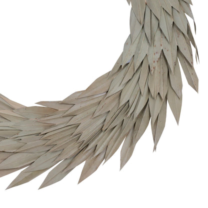 Vickerman Natural Botanicals 24" Natural Palm Sun Wreath. This wreath measures 24 inches in diameter. It features natural palm sun leaves on a coco fiber base. This is a dried and preserved natural product.