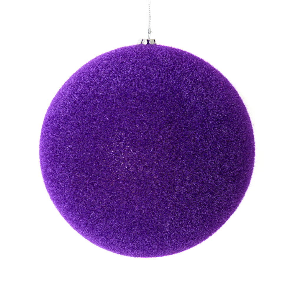 Vickerman 4" Purple Flocked Ball Ornament. This ornament has a soft layer of colored flock that will add texture to any holiday decorating project. Includes 6 pieces per bag.