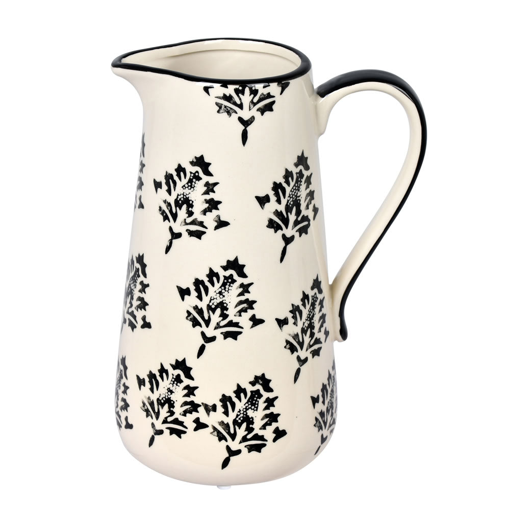 Vickerman 8.5" White/Black Leaf Print Ceramic Jar. Let this pot stand on its own or pair with a faux floral for a finished look. It measures 8.5 inches tall by 6.5 inches wide.   100% CERAMIC