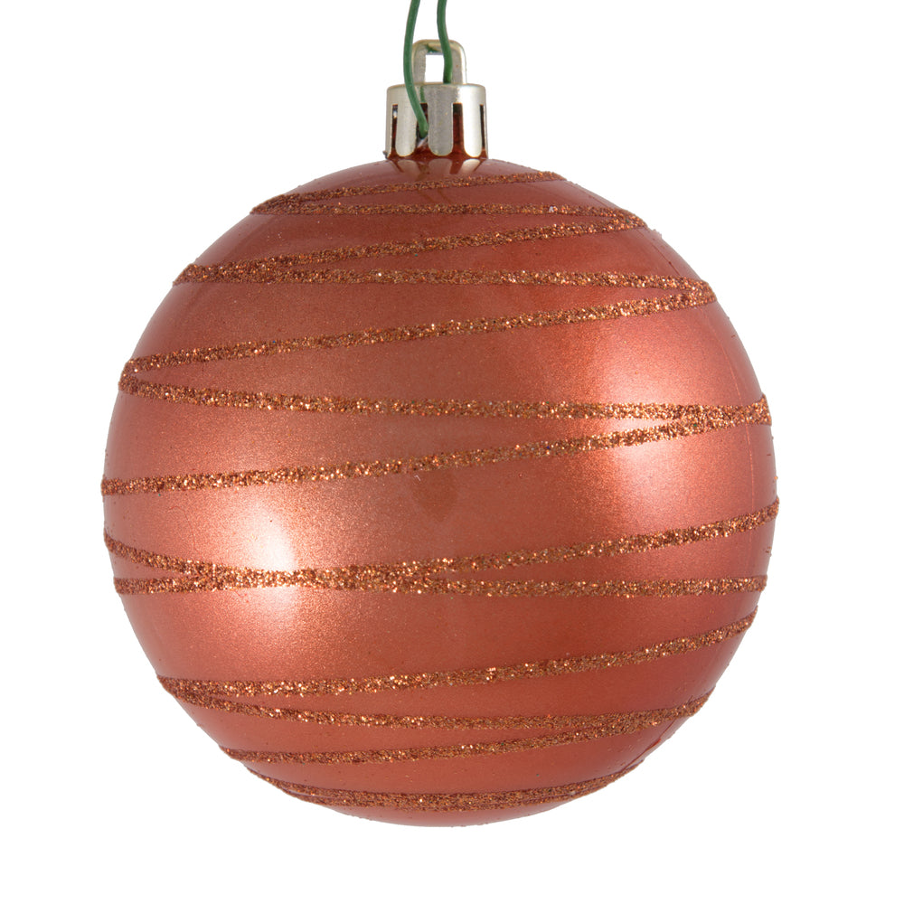 Vickerman 3" Coral Candy Finish Ball with Glitter Lines. Add some sparkle to your holiday decorating project with this candy finish ornament that features a glitter line pattern. Includes 6 pieces per bag. Made with shatterproof plastic. Ornament has a dr