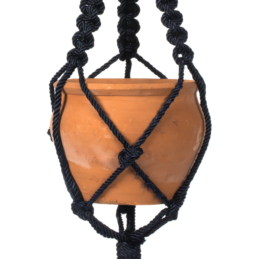 Vickerman 4.5" Terracotta Pot in Black Rope Hanger. This terracotta pot is cradled in a navy blue rope hanger. This pot incorporates great in modern decor. This pot measures 4.5 inches tall and 5.75 inches wide.   50% TERRACOTTA 50% POLYESTER