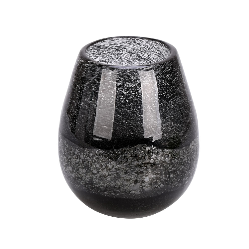 Vickerman 5" Blackberry Round Glass Vase. The dark finish of this vase exudes texture but is smooth to the touch. Pair this vase with your favorite faux floral for the perfect finishing touch. Each vase is slightly unique because each piece is hand blown.