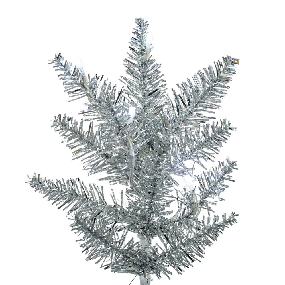 Vickerman 7.5' x 32" Silver Pencil Artificial Pre-Lit Christmas Tree with 450 Wide Angle 5mm 32 Function Remote Controlled RGB LED Mini Lights. It measures 90 inches tall, and 32 inches wide, which is considered a pencil profile. This tree boasts 965 tips