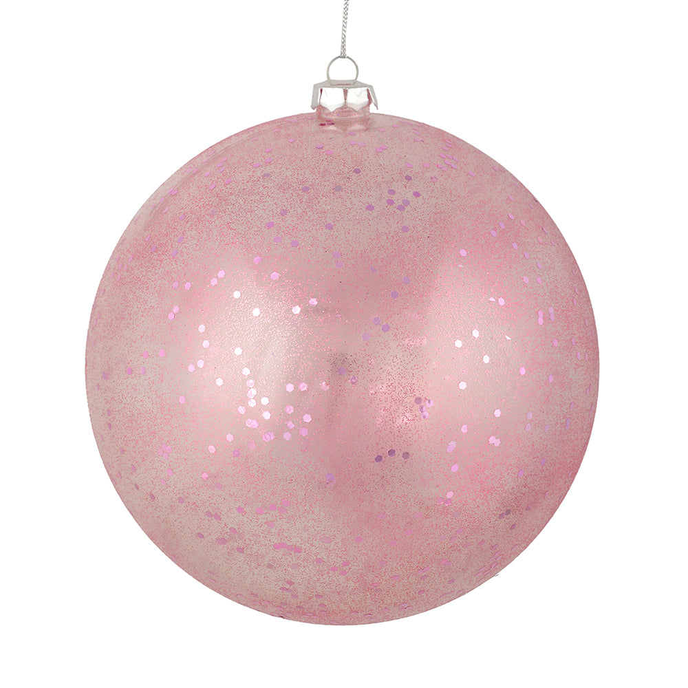 Vickerman 4" Mauve Glitter Clear Ball. This ornament features a clear complexion with a dusting of mauve glitter inside. Add a touch of glam to any holiday arrangement with this delicate looking ornament. Made with shatterproof plastic. Includes 6 pieces