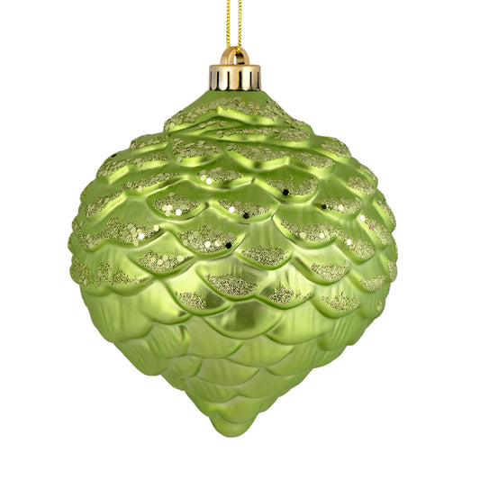 Vickerman 6" Celadon Glitter Ornament. This ornament features a matte embossed top with glitter accents and a shiny bottom. The variety of finishes on this ornament creates elegance that will complement any holiday decorating project. Made with shatterpro