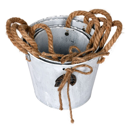 Vickerman 5-8" Tin Containers Natural Rope Handles and accents 4/pk. These baskets are made of tin and feature natural rope handles and natural rope accent  bows. This set includes 4 baskets which measure:Sm:4.75" D x 4.5" H Med:5.5" D x 4.75" H Lg:6.