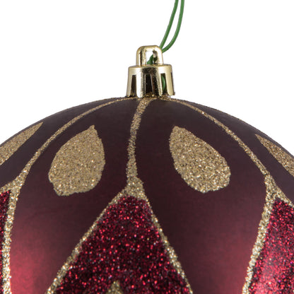 Vickerman 4.75" Wine Matte Ball with Glitter Diamond Pattern. Add variety and sparkle to your holiday arrangement with this matte ornament that features a glitter pattern. Includes 4 pieces per bag. Made with shatterproof plastic. Ornament has a drilled c