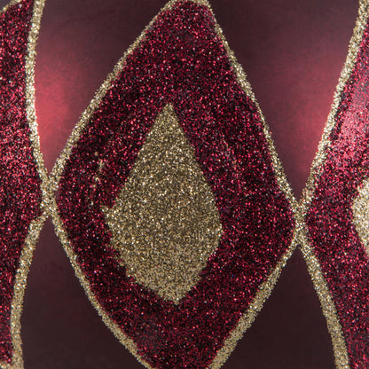 Vickerman 4.75" Wine Matte Ball with Glitter Diamond Pattern. Add variety and sparkle to your holiday arrangement with this matte ornament that features a glitter pattern. Includes 4 pieces per bag. Made with shatterproof plastic. Ornament has a drilled c