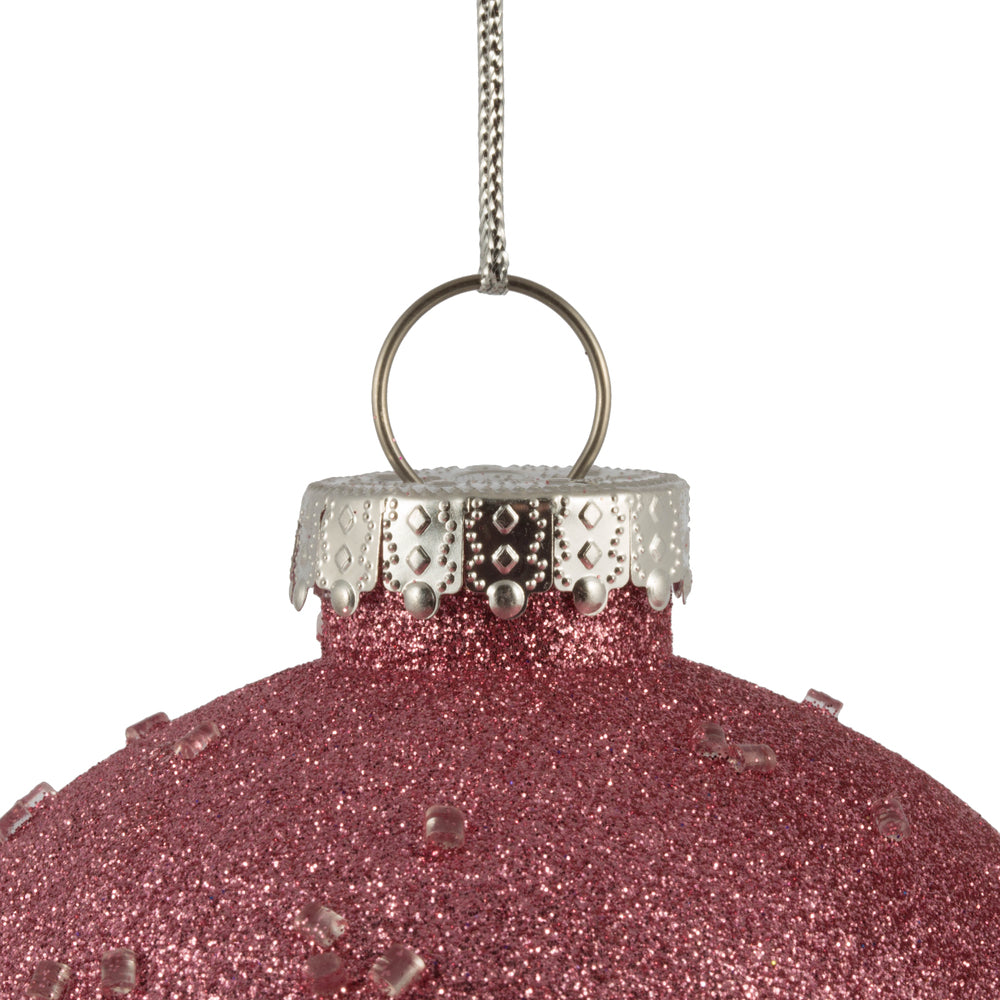 Vickerman 4.75" Mauve Ice Ball Ornament. This textured ornament has a rough and icy look with a hint of delicate sparkle. Incorporate these ornaments into your holiday design for added texture. Includes 4 pieces per pack. Made with shatterproof plastic.