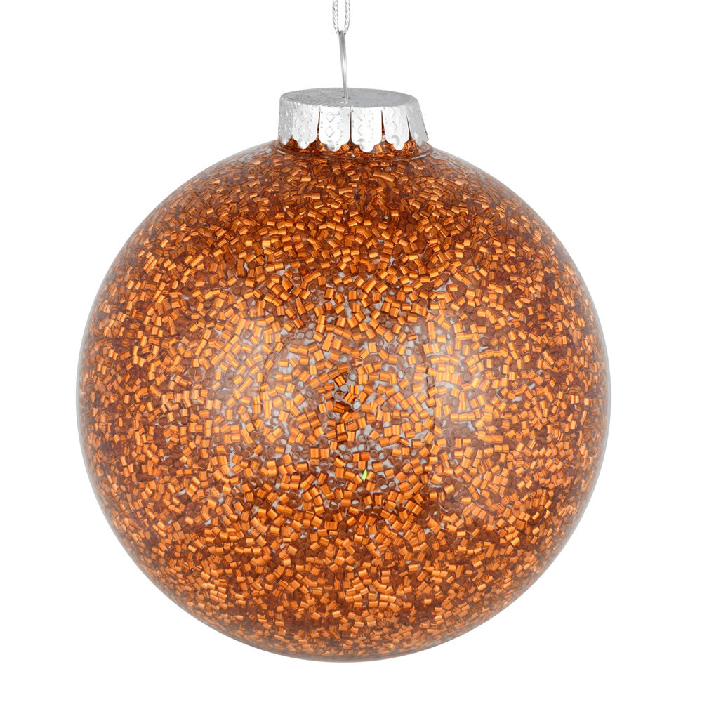 Vickerman 6" Copper Tinsel Clear Ball Orn 4/Bag. This clear ball features colored glitter and tinsel on the inside. Add some sparkle to your holiday decorating projects with this tinsel ornament. Made with shatterproof plastic to reduce the likelihood of