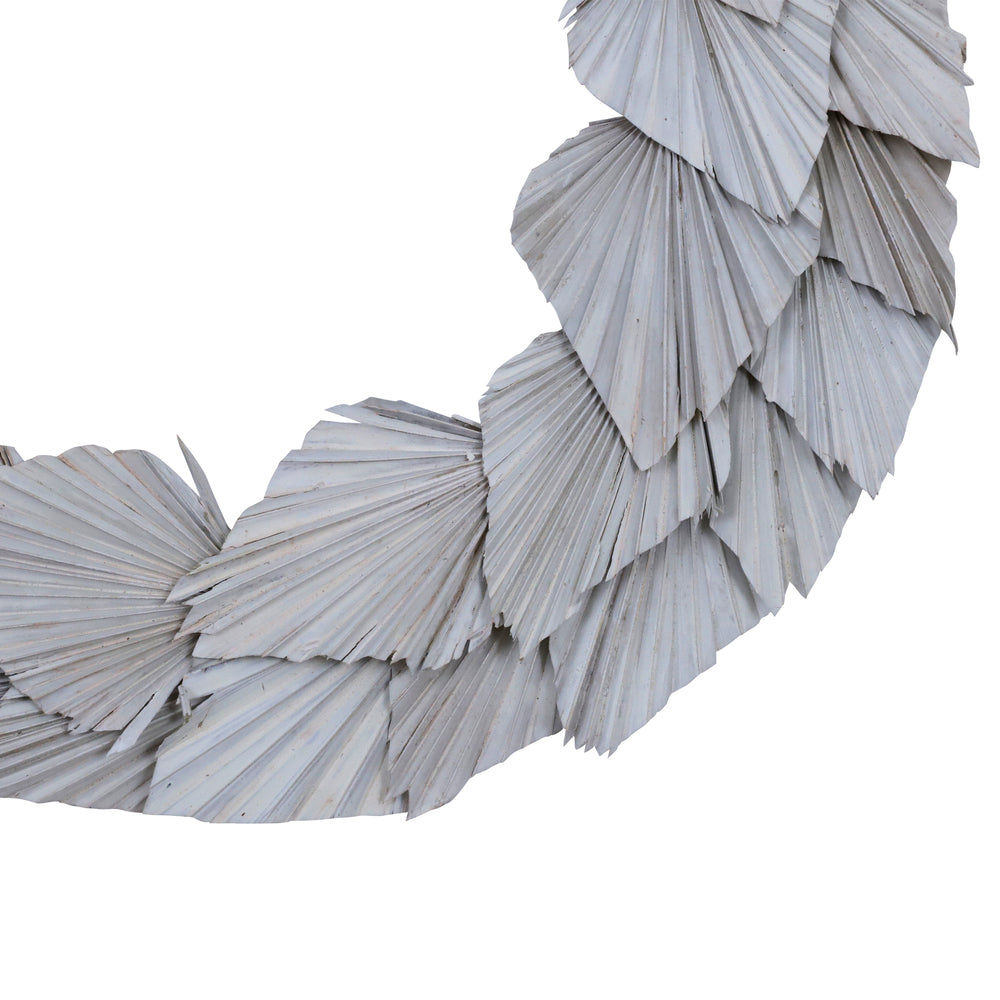 Vickerman Natural Botanicals 24" White Washed Palm Spear Wreath. This wreath measures 24 inches in diameter. It features white washed palm spear leaves on a coco fiber base. This is a dried and preserved natural product.