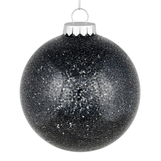 Vickerman 6" Black Tinsel Clear Ball Orn 4/Bag. This clear ball features colored glitter and tinsel on the inside. Add some sparkle to your holiday decorating projects with this tinsel ornament. Made with shatterproof plastic to reduce the likelihood of b