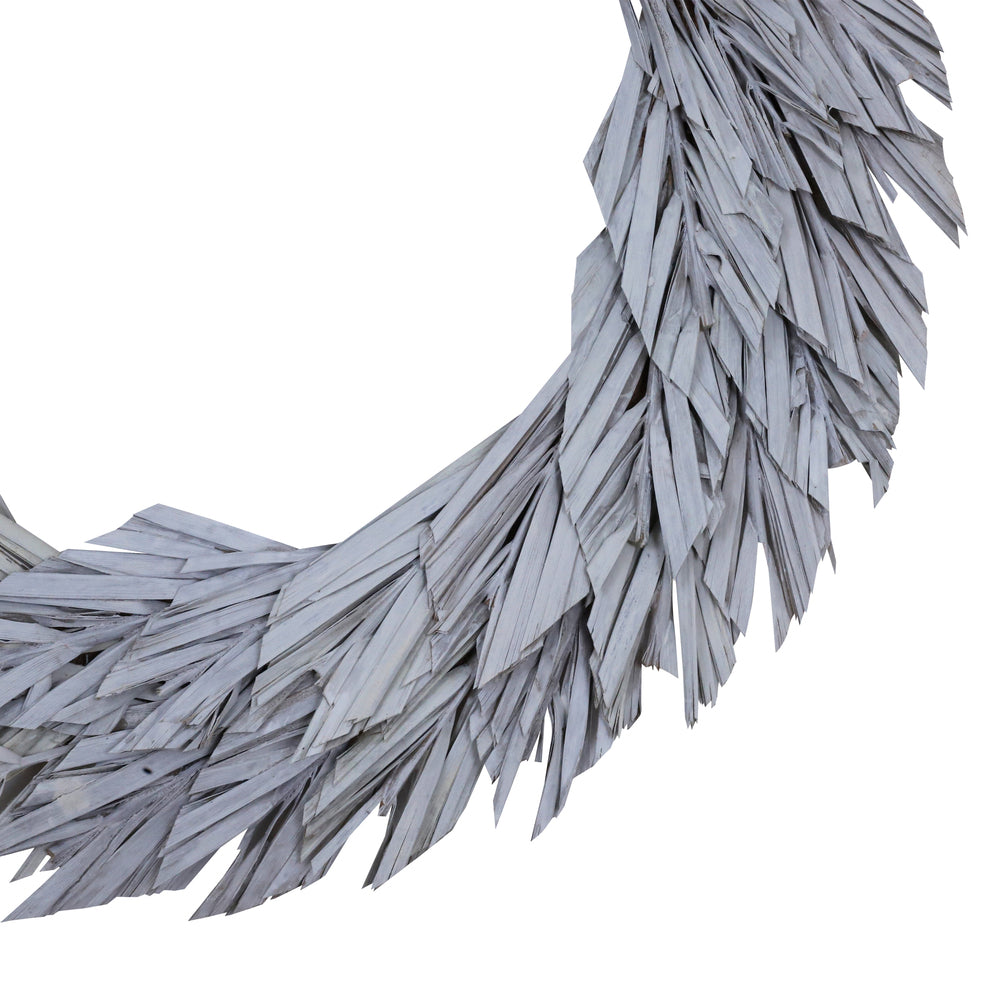 Vickerman Natural Botanicals 24" White Washed Canna Leaf Wreath. This wreath measures 24 inches in diameter. It features white washed canna leaves on a coco fiber base. This is a dried and preserved natural product.