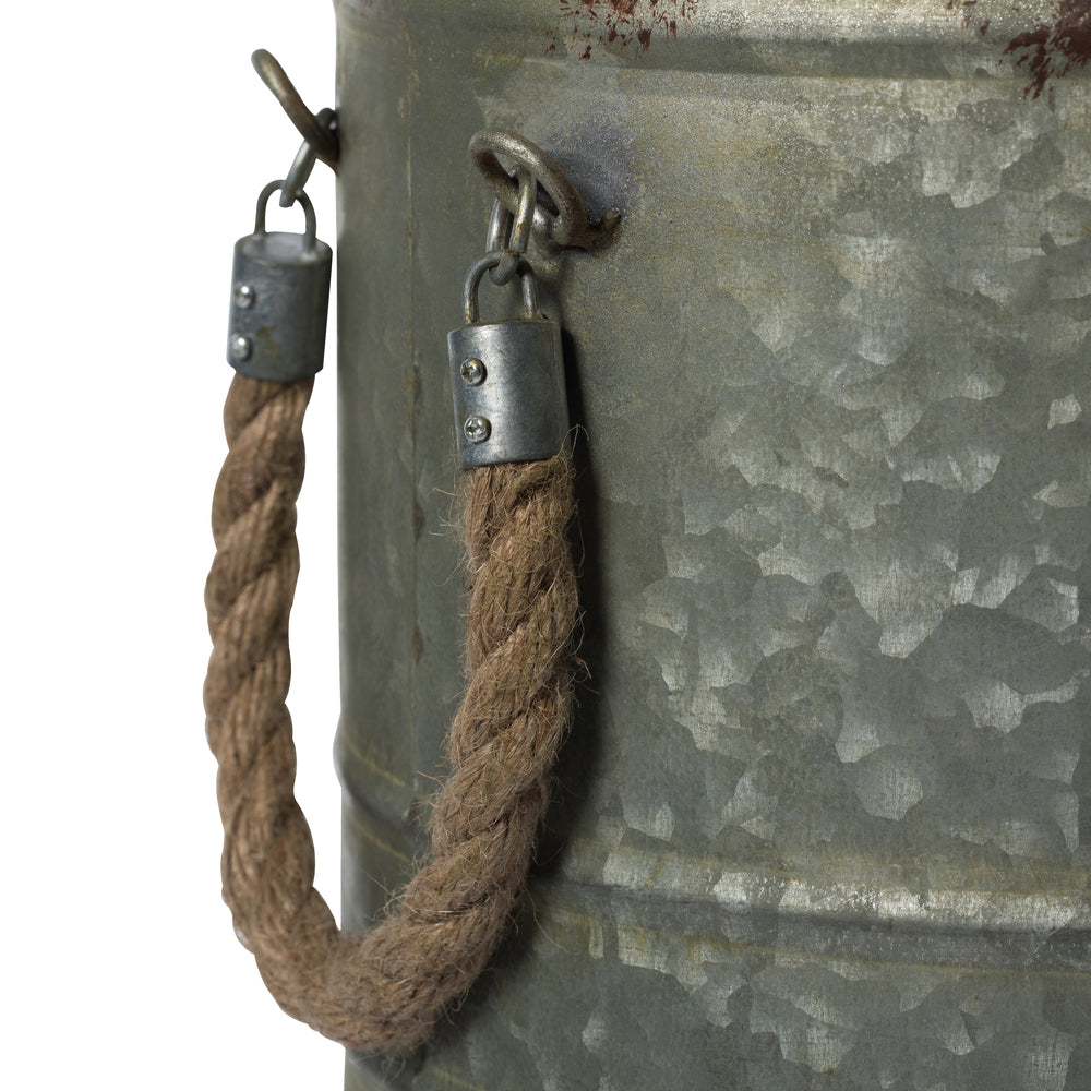 Vickerman 19.5" Rustic Metal Container with Handles. This metal container is the perfect addition to any modern farm style decor. This rustic piece is the perfect addition to any table top setting. It measures 10.5" L x 11" W x 19.5" H.   90% METAL 10% JU