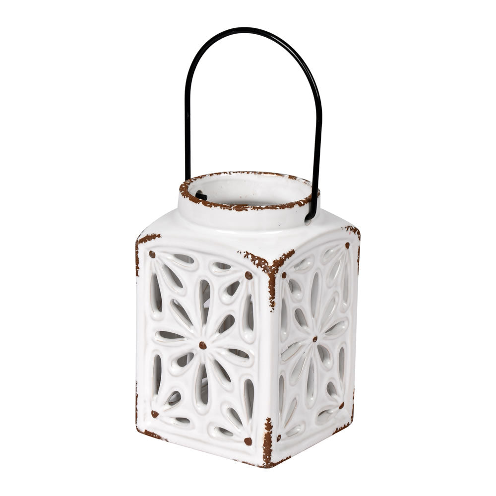 Vickerman 6.25" x 4" White Ceramic Candle Lantern. This lantern features cut outs and is perfect for a small candle. It includes a metal loop to ensure easy hanging.