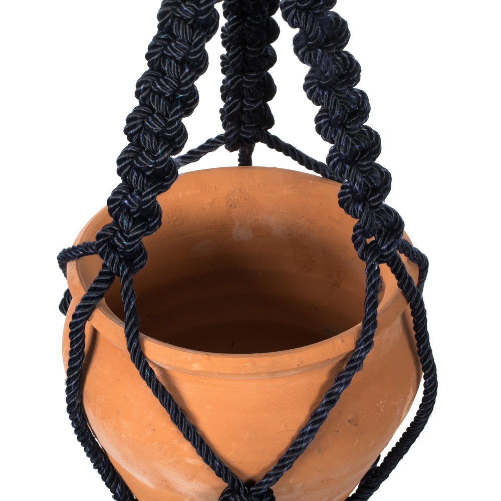 Vickerman 4.5" Terracotta Pot in Black Rope Hanger. This terracotta pot is cradled in a navy blue rope hanger. This pot incorporates great in modern decor. This pot measures 4.5 inches tall and 5.75 inches wide.   50% TERRACOTTA 50% POLYESTER
