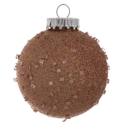 Vickerman 3" Rose Gold Ice Ball. This textured ornament has a rough and icy look with a hint of delicate sparkle. Incorporate these ornaments into your holiday design for added texture. Includes 12 pieces per pack. Made with shatterproof plastic.